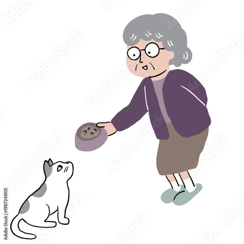 おばあさんがねこに餌をあげている2