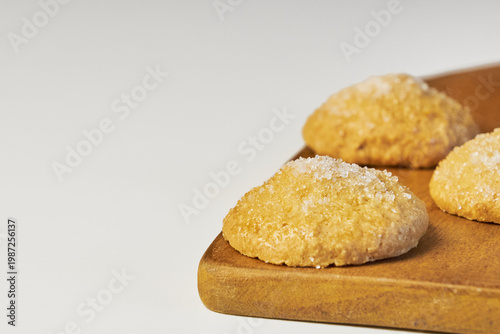 Sweet sugar cookies on wooden tray ready for enjoying