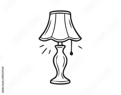 Table lamp with sculpted base and fabric shade casting warm ambient light, bedside or living room accessory creating cozy atmosphere, pullchain detail and textured shade highlight classic interior