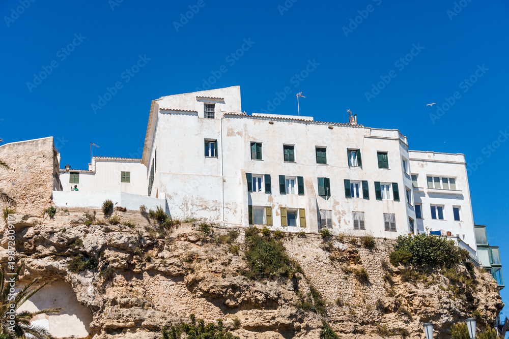 Fototapeta premium Mao, Menorca Buildings on Cliff