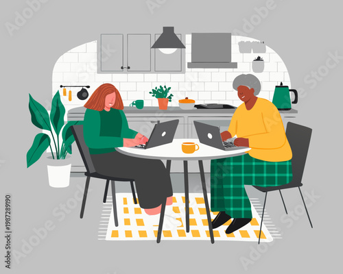 Two women working remotely on laptops at a kitchen table