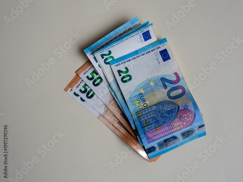 Euro cash money notes symbolizing inflation, salary, income, wages, social benefits and personal finance