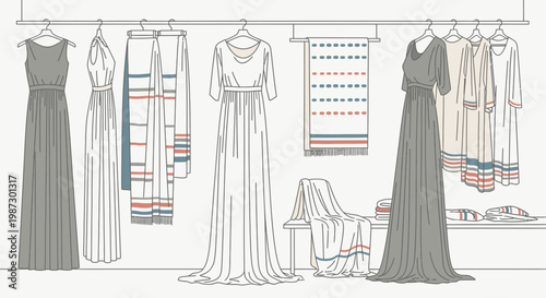 Elegant collection of women's dresses and a scarf hanging on a rack and draped, fashion display, bright studio.