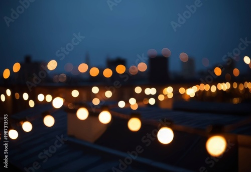 Bokeh of string lights on night terrace and city lights