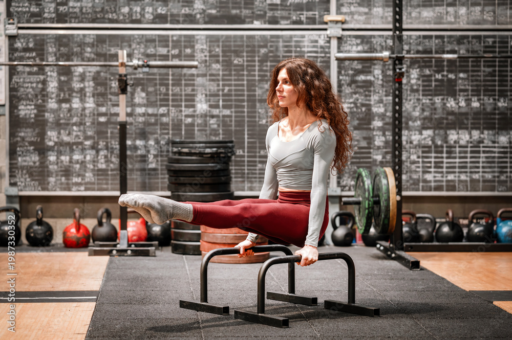 custom made wallpaper toronto digitalWoman performing L sit exercise on parallel bars in gym