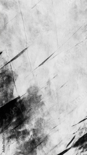 A monochromatic abstract composition featuring dynamic textures and contrasts of light and dark