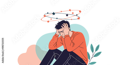 Suffering young man sitting on the ground and holding his head in pain with stars swirling around representing a migraine or dizziness.