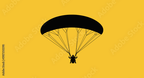 Silhouette Of A Person Paragliding Against A Bright Yellow Background