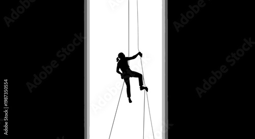 Silhouette Of A Woman Rappelling Down A Steep Vertical Drop Against A Bright Sky