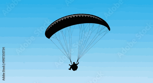 Silhouette Paraglider Soaring Through Clear Blue Skies