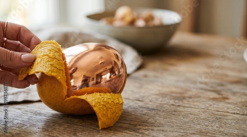 Wallpaper Mural Action of Peeling a Copper-Glazed Dessert, Food Preparation, Cozy Kitchen, Photography, Warm Atmosphere, Close-Up, Culinary Art Torontodigital.ca