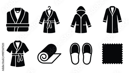 Set of black bathrobes slippers rolled towel and fabric swatch on transparent background