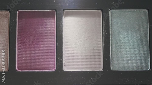 Elegant fourcolor cosmetic kit. Compact makeup compact featuring silky textures and sparkling finishes suitable for tutorials or displays