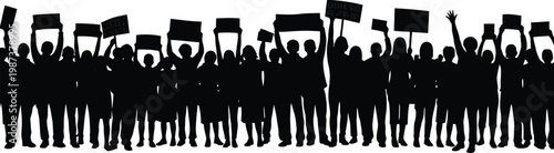 Silhouette of a large crowd of people holding flags and signs