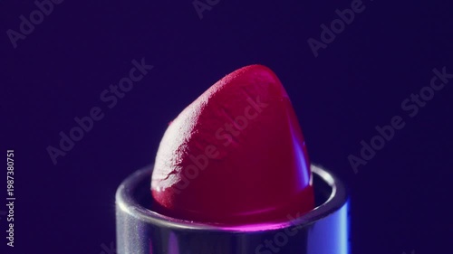 Closeup of vibrant magenta lips. Highquality studio image showcasing vibrant lipstick with deep purple background for promotional use
