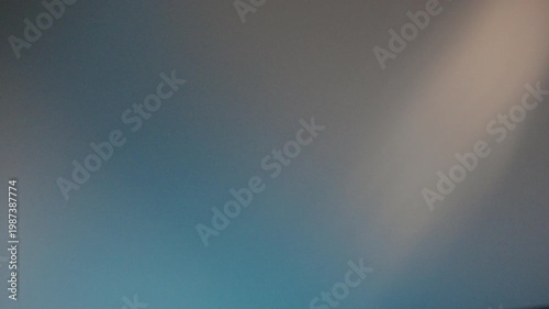 Muted pastel wash with soft bokeh and warm tones, subtle gradient from blue to beige, calm texture ideal for background overlays, elegant studio light