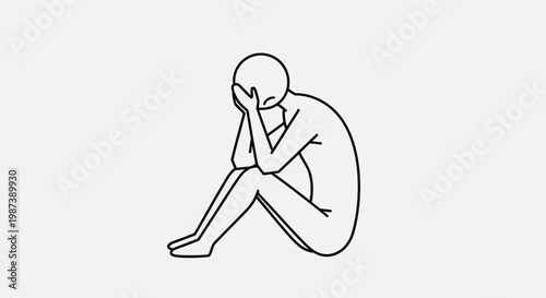 A person sitting in a state of sadness and contemplation.