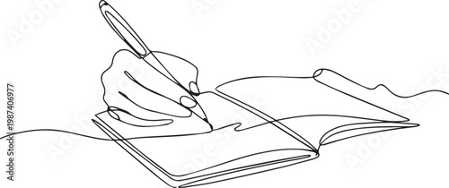 A hand holding a pen writing in an open book on a white background
