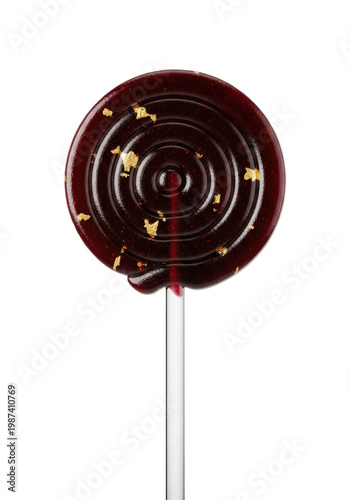 single, glossy, black cherry swirl lollipop with sparse edible gold flakes, macro still life against a transparent studio background with generous copy space. concept for high-end confectionary