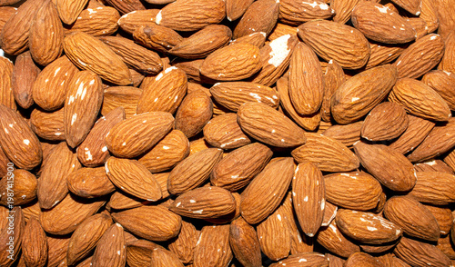 Almonds and peeled nuts.Almonds are edible seed kernels or the seeds of the plant of the same name from the Almond subgenus of the Plum genus.Almonds are common.