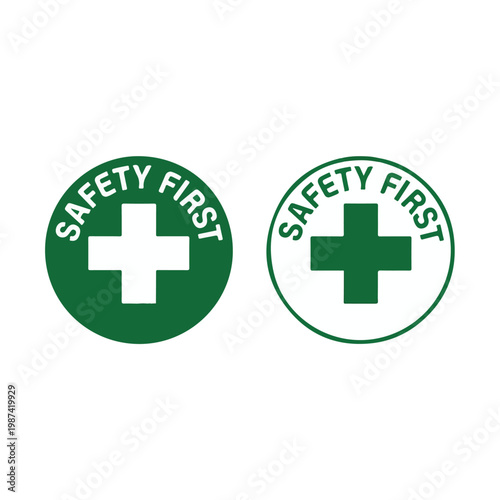 Two graphic 'Safety First' icons, each featuring a prominent cross symbol within a green circle, designed for clear communication of essential health, caution, and workplace safety information