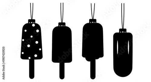 Four black hanging ice cream popsicle silhouettes with one polka dot design on white background