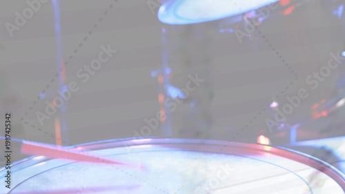 Snare anchoring camera panning up tom cymbal entering overlay drifting lights bathing kit for music