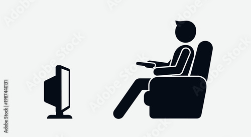 Person watching television while sitting on a comfortable chair.