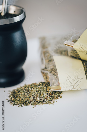 Billede på lærred Traditional yerba mate tea in a black modern gourd with bombilla