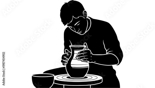 Potter silhouette creating a beautiful ceramic vase on a wheel