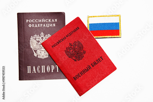 Russian passport and military identification card with state flag patch. Official identity documents