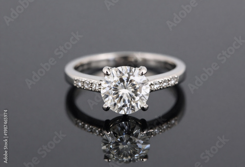 Luxury Diamond Engagement Ring with Round Cut Solitaire and Pavé Band on Black Reflective Background Elegant White Gold Jewelry Product Photography.