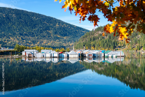 Boat Houses on Kootenay Lake Nelson BC. Boat Houses reflecting on calm, Kootenay Lake in Nelson, British Columbia. 
