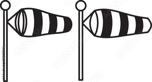Two black and white striped windsock indicators on poles wind direction air flow windsock direction streamer indicator meteorology measurement atmosphere condition forecast