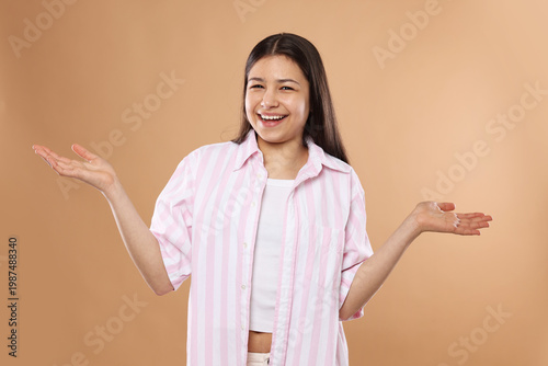 Photos Portrait of beautiful teenage girl on beige background