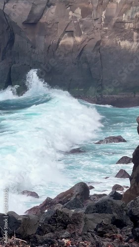 Rocky ocean cove with turquoise waves crashing against cliffs in azores portugal dramatic coastal seascape