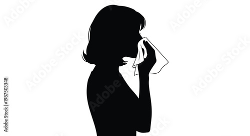 A stark black silhouette depicts a woman delicately holding a tissue to her nose suggesting illness or sadness silhouette high quality professional detailed