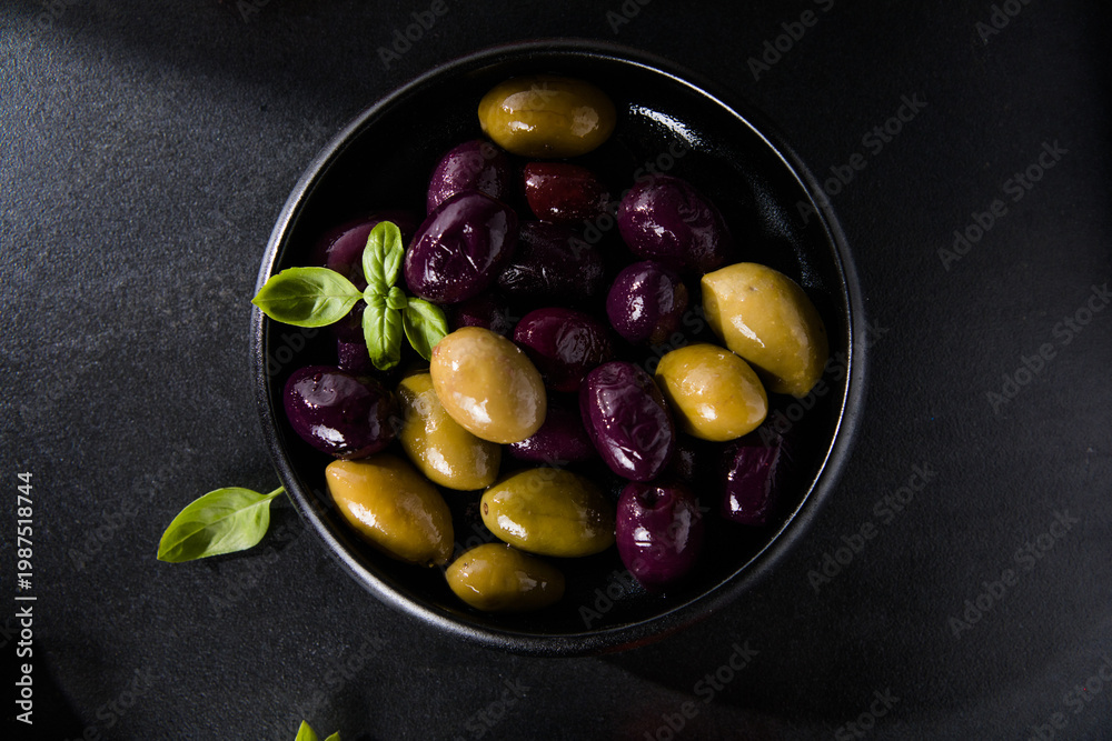 Ταπετσαρία Olives calamata in a bowl on the table. Top view