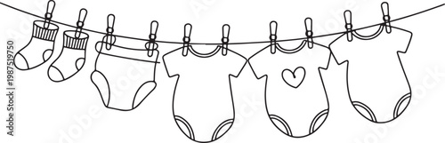 Baby Clothes Drying on a Clothesline laundry socks
