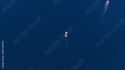 Aerial view of small boats cruising on the deep blue Adriatic Sea in Croatia, summer travel and vacation concept
