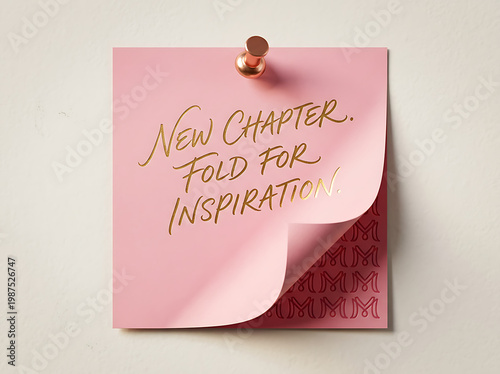 Pink sticky note with inspirational quote and gold text on white background