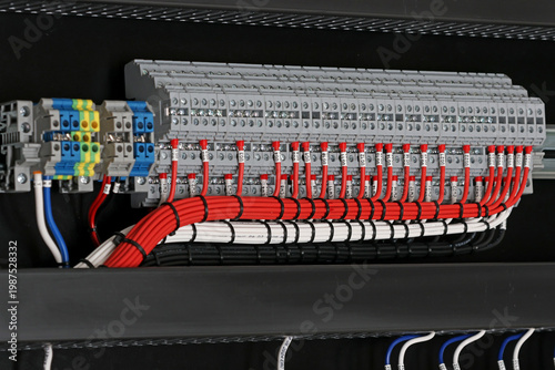 Electrical screw terminals for connecting copper electrical wires with metal lugs in electrical switchboard. 