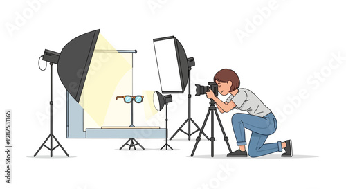 A photographer taking a picture with studio lighting equipment.