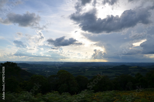 Dramatic sky over valley with wildflowers in Serra Gaúcha, Rio Grande do Sul, Brazil