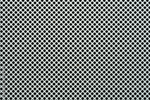 Quadro em tela A close up shot of a white perforated window film with a dense pattern of small circular holes designed for one way vision