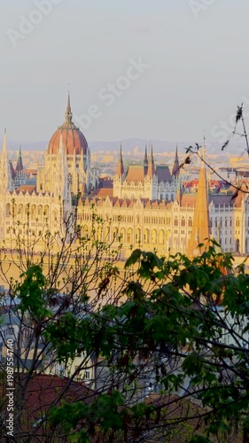 Aerial 4K vertical video footage of Hungarian Parliament Building, Parliament of Budapest. Aerial drone view of Budapest architecture, stunning historic building. Sunset and golden hour