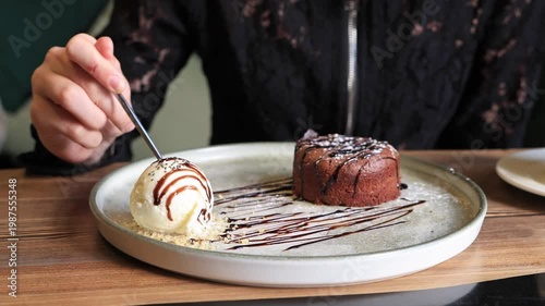 Delicious chocolate fondant dessert with ice cream.