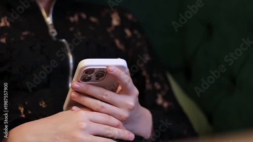 A man holds a smartphone in his hands, close-up, slow motion video.