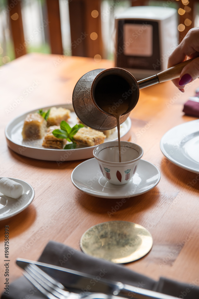 custom made wallpaper toronto digitalHot coffee in a cezve. Turkish and Arabic style of making coffee. A woman's hand pours hot coffee into an Arabic cup.Selective focus, close-up.