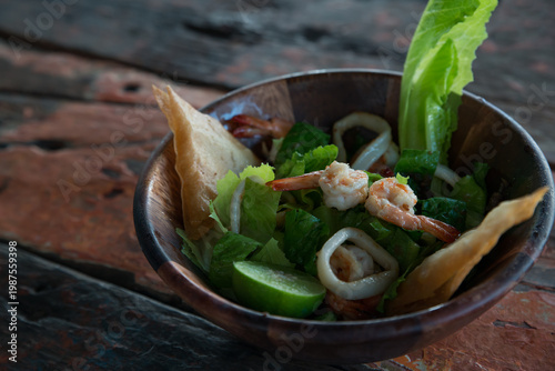Wallpaper Mural Salad with seafood and shrimps and lettuce on old wooden table. Close Up, Selective focus. Top view, flat lay. Torontodigital.ca